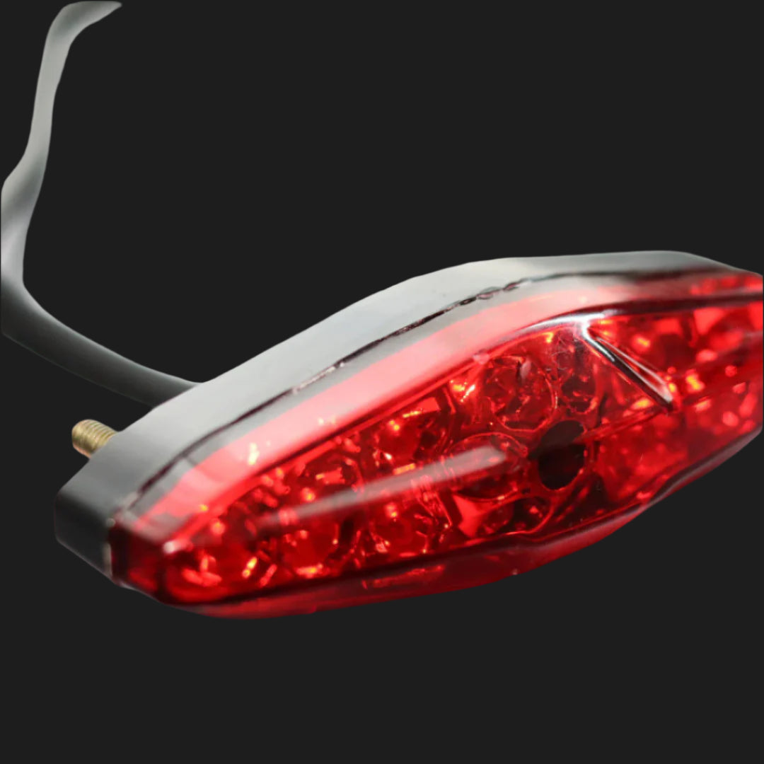 Close-up of a red LED light on a gray background